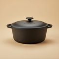 Cast Iron Dutch Oven 6Qt on warm beige background